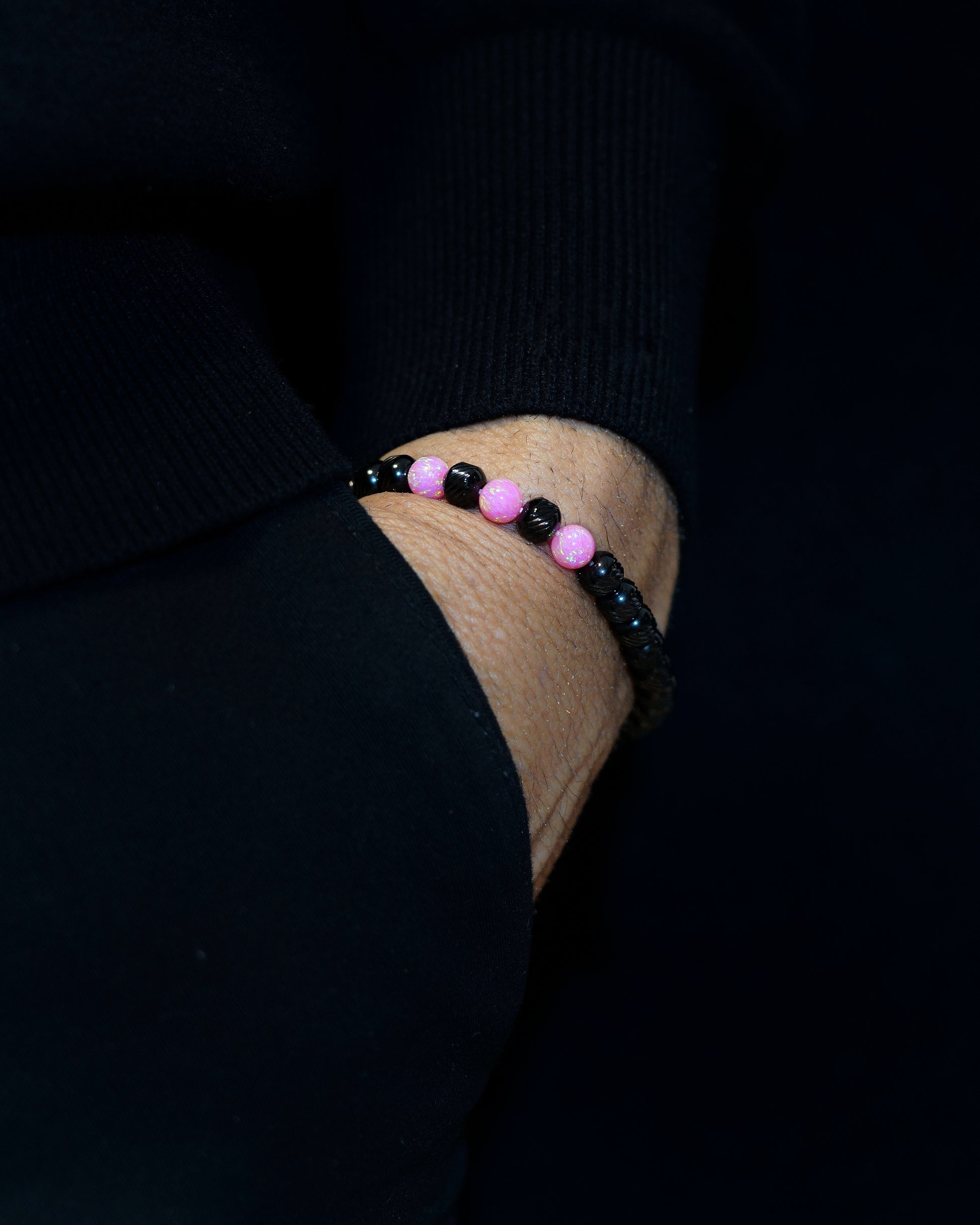 BLACK MAMBA BRACELET WITH BLACK OBLIQUE TEXTURED STAINLESS STEEL, COMBINE WITH  SILKY PINK GEMS. THE SPECIAL MUDRA CHAIN`S THREE DOTS DESIGN.
