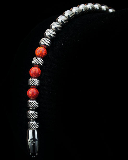 Stainless steel handcrafted bracelet with 5/6 mm beads, with three fire red opal gemstones. Easy to wear suitable for men and women.